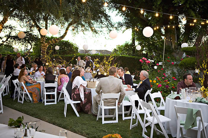 We love this look for backyard weddings But if you borrow the chairs from