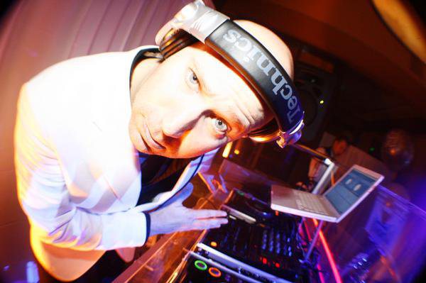 DJ Brian Howe behind the decks at a Denver nightclub